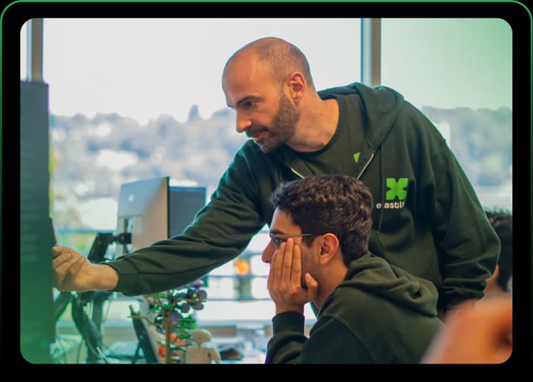 ElastixAI engineers collaborating in the hardware lab