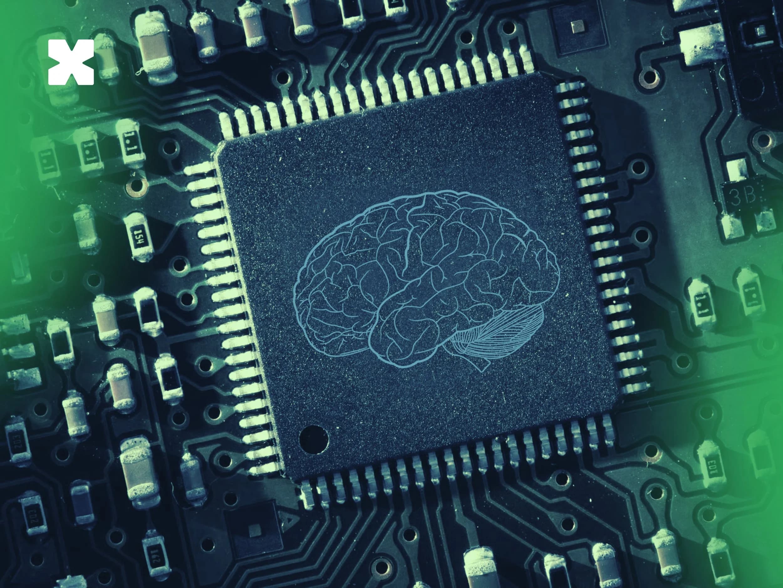A processor chip with a brain motif etched onto its surface, on a green-lit circuit board.